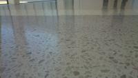 White polished concrete with large exposed aggregate 